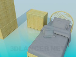 Conjunto de muebles de mimbre en el dormitorio