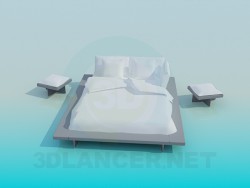 Cama matrimonial con mesas de