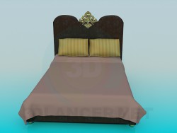 Cama con decoración de oro